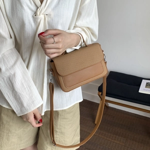Brown woven patchwork crossbody bag with top handle and adjustable strap for women