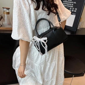 Chic black leather Boston bag with lace pearl bow and adjustable shoulder strap