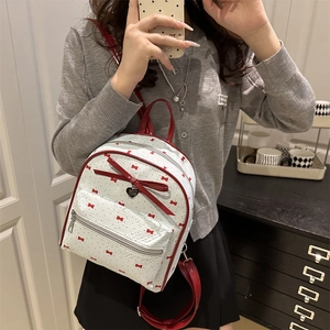 White mini backpack with red bow print and heart pendant for casual daily wear