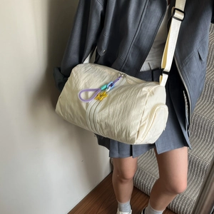 Chic beige cylinder canvas tote bag for women with star charm and adjustable strap