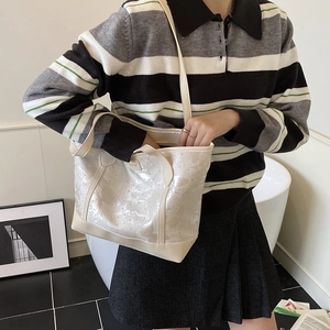 Minimalist white glossy tote bag for women with floral pattern and long shoulder straps