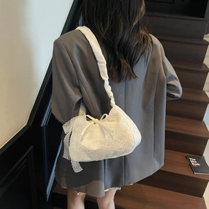 Elegant white lace tote bag for women featuring floral embroidery and ribbon bow accents