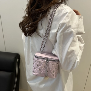 Chic quilted lavender chain bag with diamond stud detail for stylish women
