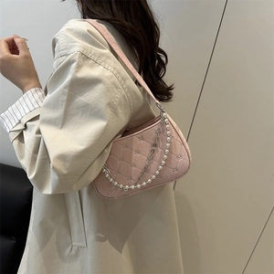 Pink quilted baguette shoulder bag with pearl and silver chain straps for women