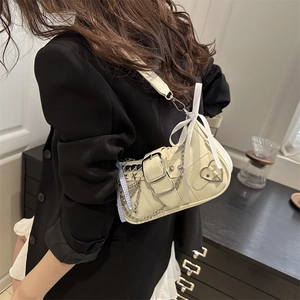 Chic cream white Y2K underarm bag with silver buckle, chain, and ribbon bows