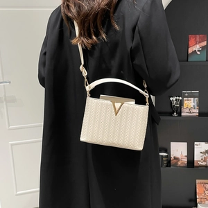 Elegant ivory woven leather crossbody box bag with gold V hardware and top handle strap