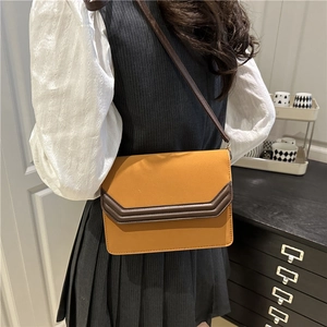 Chic earthy brown suede patchwork flap crossbody bag for women in a trendy autumn style