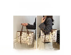 Fashionable tote bag with graffiti prints and a cute plush rabbit pendant charm