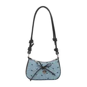 Light blue crescent underarm bag with pleated texture and black ribbon bow accents