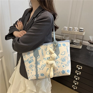 Large capacity canvas tote bag with cute blue cartoon print and plush bunny keychain
