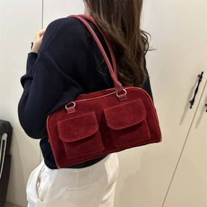 Retro red suede handbag for women featuring front utility pockets and silver metal hardware