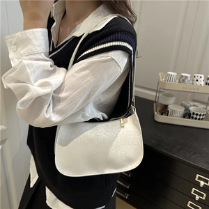 Chic white snake-embossed faux leather underarm bag with gold zipper and adjustable strap