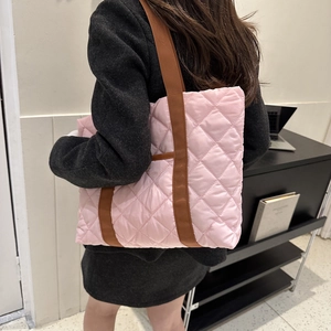 Chic pink quilted puffer tote bag with brown straps for autumn and winter fashion