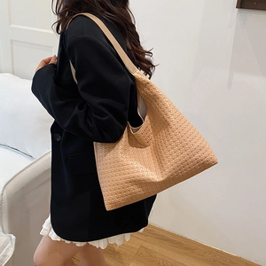 Chic tan woven hobo tote bag for women featuring a spacious interior and comfortable strap