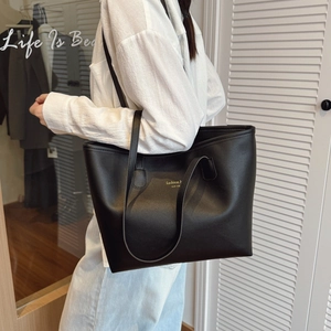 Bolso tote negro para mujer con letras doradas de New York en la parte frontal