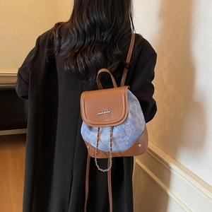 Mini brown leather and blue denim patchwork backpack with metal chain and logo