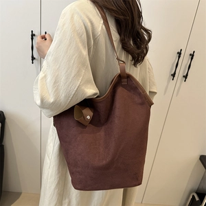 Minimalist large brown suede tote bag for women showing spacious commuter style design