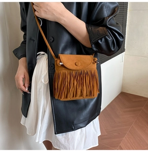 Brown fringe suede crossbody bag with long tassels in a bohemian western style