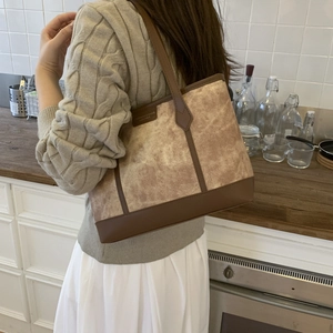 Vintage canvas and leather tote bag for women shown in a cozy kitchen setting