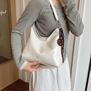 Chic white patent leather underarm hobo bag with fashion text and charm strap