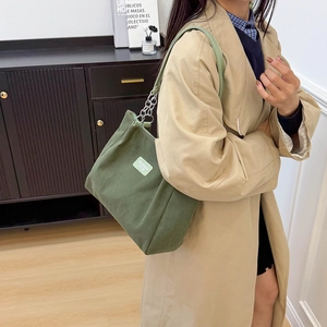 Stylish dark green corduroy tote bag with silver chain straps and large capacity for women