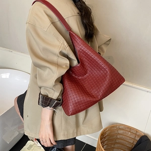 Retro burgundy woven leather hobo tote bag for women showing a large capacity shoulder design