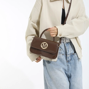 Chic dark brown patent leather handbag with gold M logo and glossy crossbody strap
