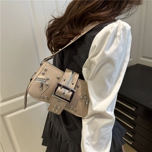 Beige Y2K baguette bag with silver studs and metal buckle in a vintage punk style
