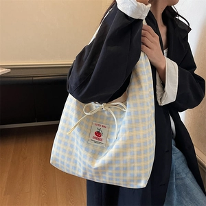Blue and yellow plaid canvas tote bag with drawstring bow and handmade label for daily use