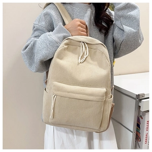 Detail of striped corduroy backpack with cotton rope zipper and side pocket for water bottle