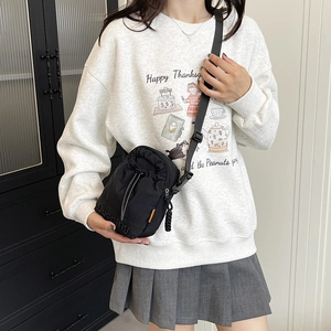 Japanese style black drawstring crossbody phone bag with adjustable nylon shoulder strap