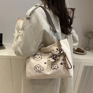 Minimalist beige canvas tote bag with cute cat prints and brown leather handles