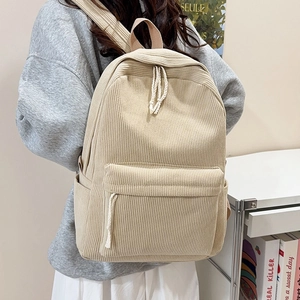 Beige corduroy backpack for women showing a striped texture and large capacity main compartment