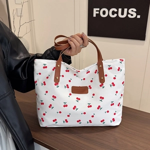 Chic cherry print canvas tote bag with leather straps and large capacity for daily commute