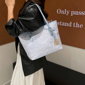 Chic light blue and white printed tote bag with large capacity and gold metal charm