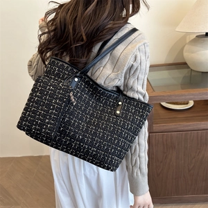 Large capacity black and gold tweed shoulder bag with leather straps and metal rivets