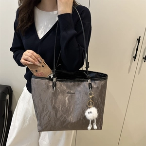 Gray large capacity tote bag with pleated texture and plush pendant for daily commute