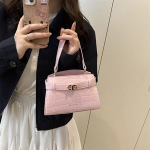 Pink croc-embossed leather top handle crossbody bag with luxury gold tone lock