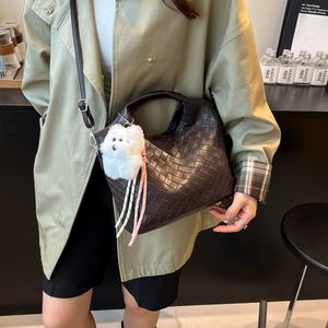 Brown woven leather shoulder bag with cute white dog charm and large capacity design