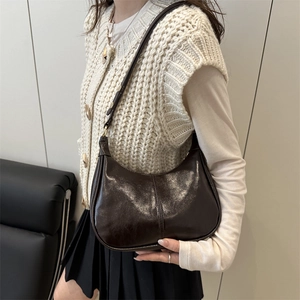 Retro dark brown hobo shoulder bag in glossy patent leather finish with gold hardware