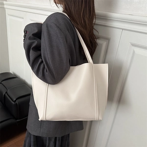 Minimalist beige large capacity tote bag in smooth PU leather for daily commuting style