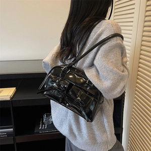Chic black patent leather shoulder bag with bow details and balletcore style