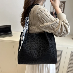 Retro leopard print tote bag in dark suede with decorative scarf on shoulder strap