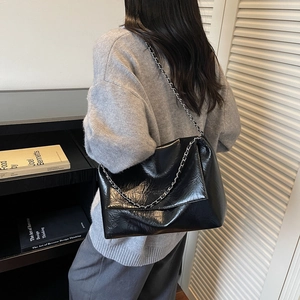 Large black shoulder bag with shiny crinkle leather and silver chain strap for women
