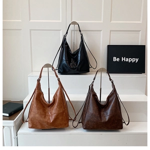 Three large capacity faux leather convertible backpacks in black, brown, and coffee tan