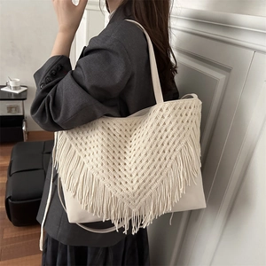 Retro hollow woven beach tote bag with bohemian fringes and long shoulder strap