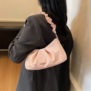 Chic pink pleated cloud bag for women featuring a ruffled strap and gold metal logo
