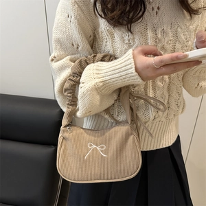 Khaki corduroy shoulder bag with embroidered bow and ruffled strap for autumn style
