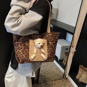 Fashionable leopard print tote bag with 3D plush bear detail and long shoulder straps