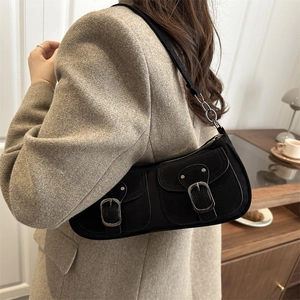 Chic black faux suede underarm bag with double front pockets and metallic buckles